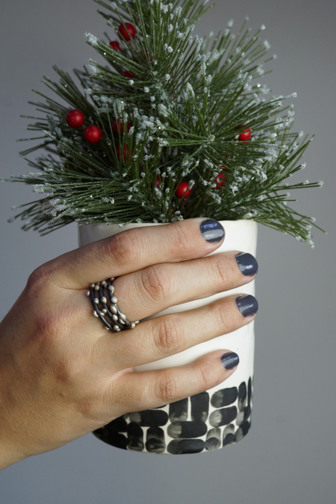 handmade holiday decor: faux tree in black and white handmade ceramic cup (with mixed metal silver on steel stacking rings)