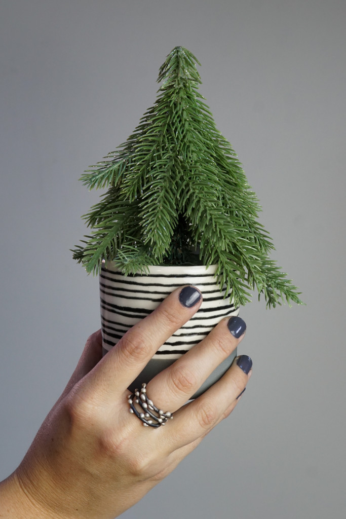 holiday decor: mini evergreen tree in handmade ceramic cup (show with handmade mixed metal stacking rings)