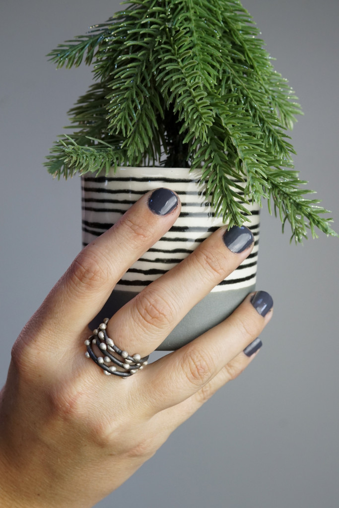 holiday decor: mini evergreen tree in handmade ceramic cup (show with handmade mixed metal stacking rings)