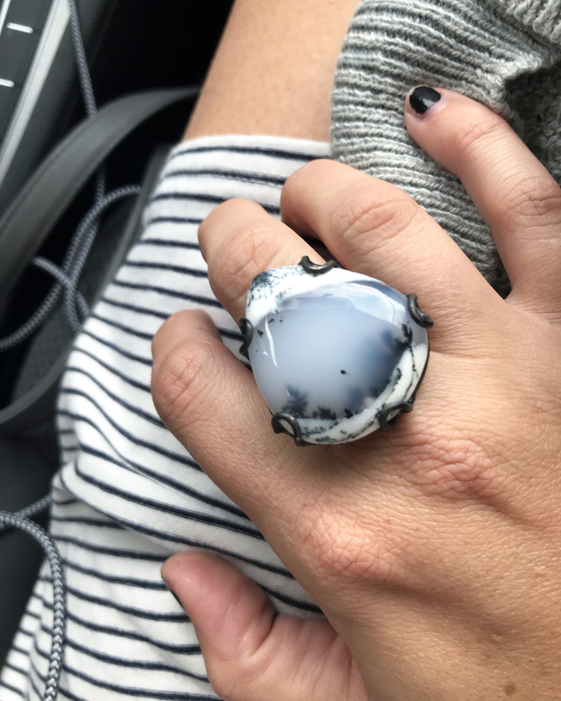 one of a kind handmade gemstone statement ring with black and white stripe dress and grey cardigan