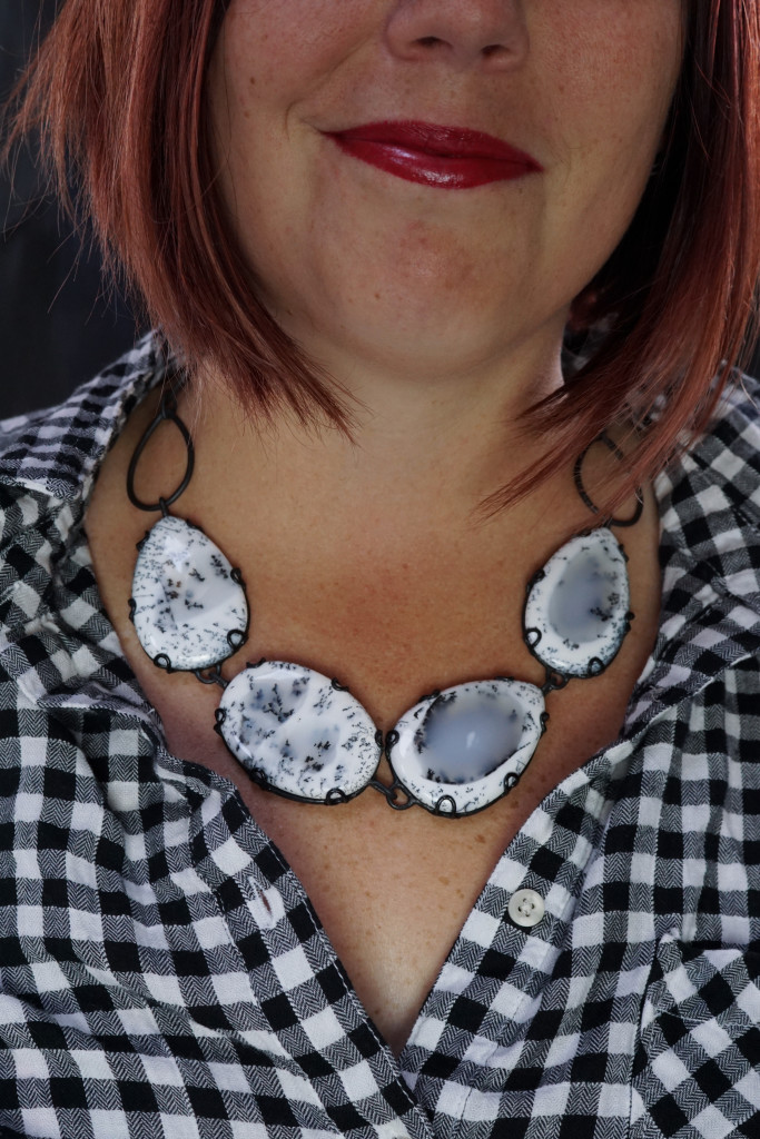 fall winter holiday style: black and white plaid shirt with black and white chunky gemstone statement necklace