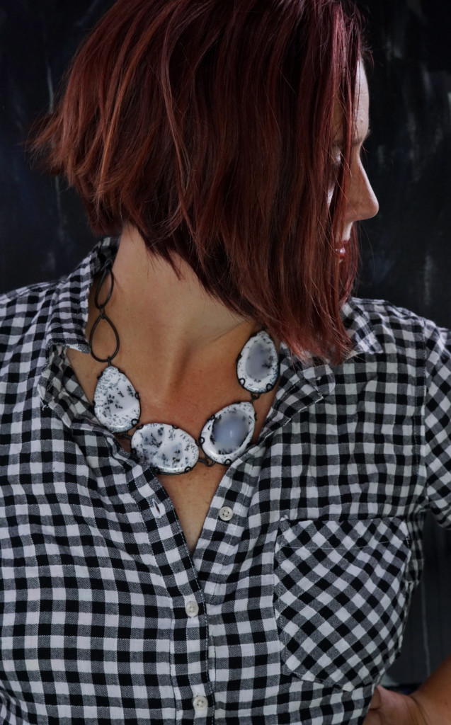 fall winter holiday style: black and white plaid shirt with black and white chunky gemstone statement necklace