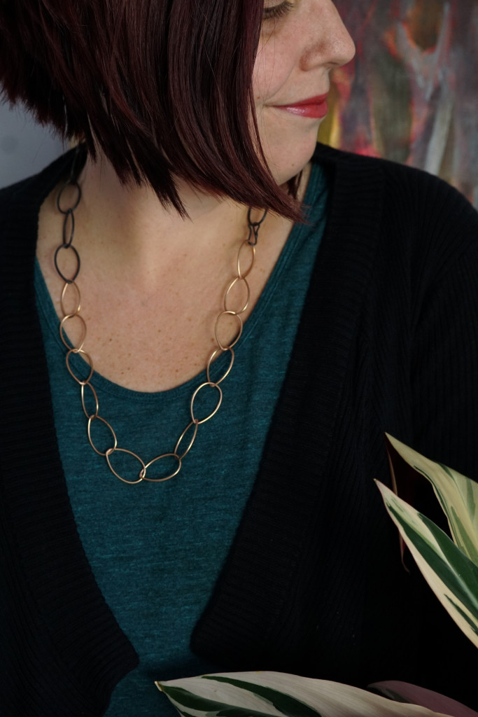 casual style: mixed metal bronze and black classic chain link necklace with t-shirt and cardigan