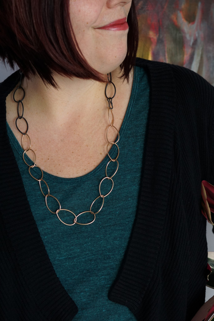 casual style: mixed metal bronze and black classic chain link necklace with t-shirt and cardigan