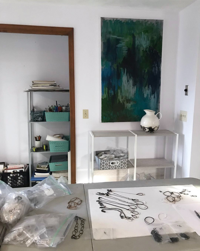 art jewelry studio with abstract painting