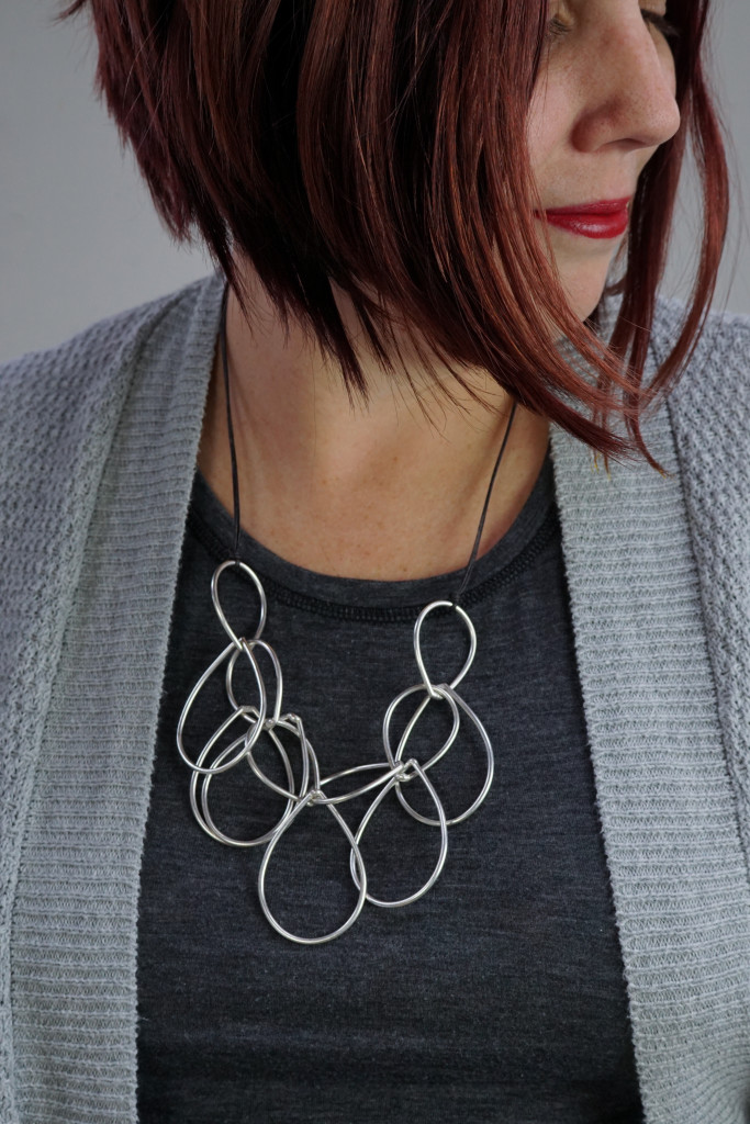 modern contemporary bold jewelry: silver chain link statement necklace on leather cord