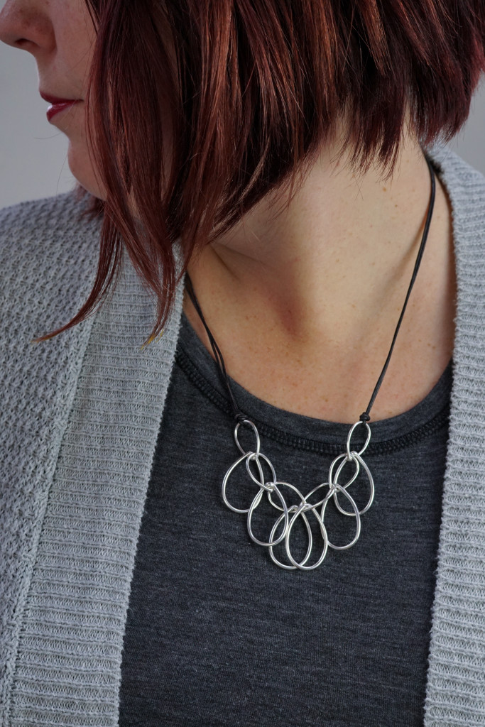 modern contemporary bold jewelry: silver chain link necklace on leather cord