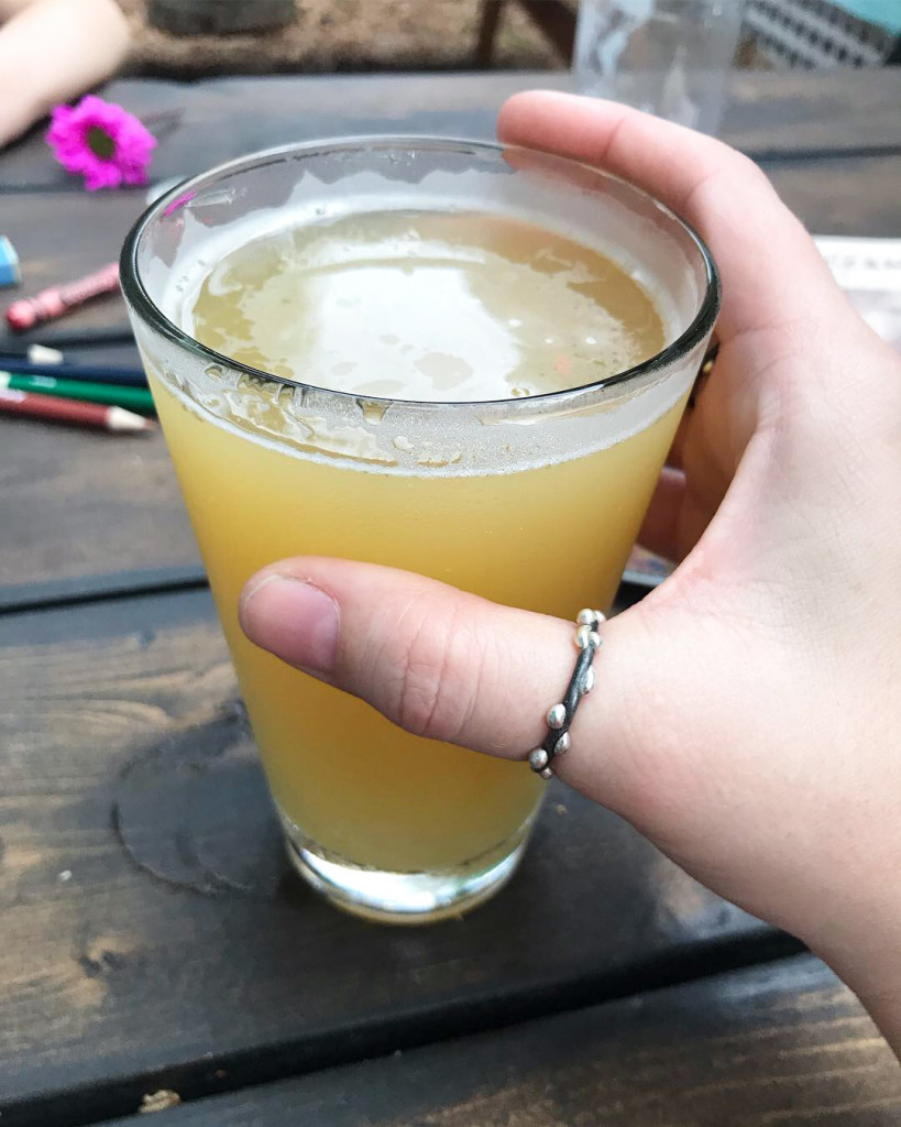 beer and mixed metal thumb ring at outdoor restaurant in Sarasota, Florida