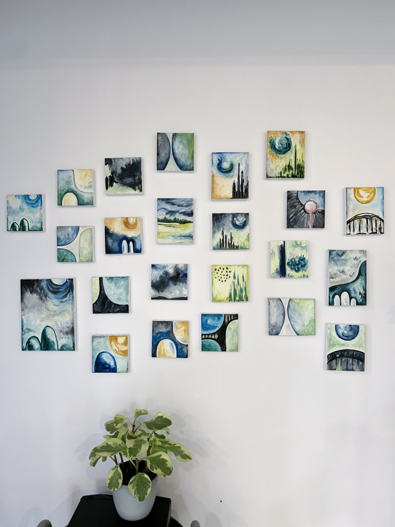 gallery wall with tiny abstract paintings