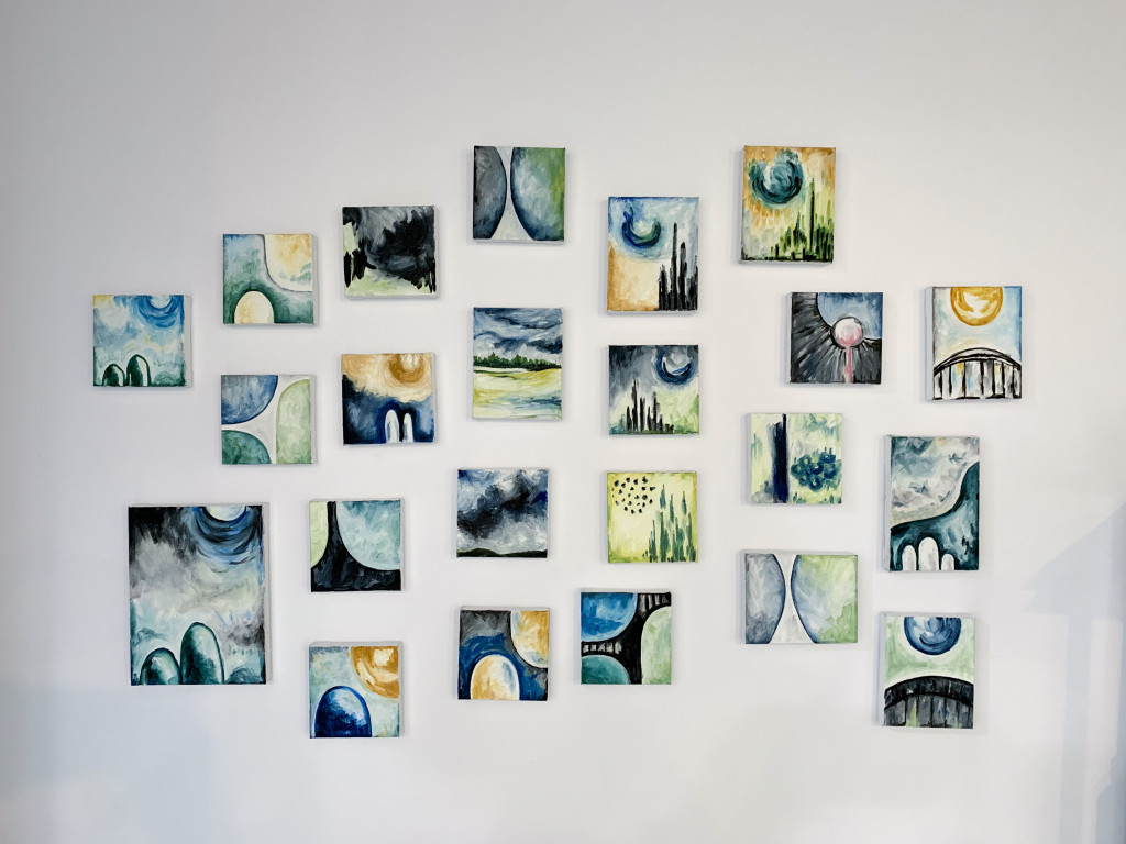 gallery wall with tiny abstract paintings