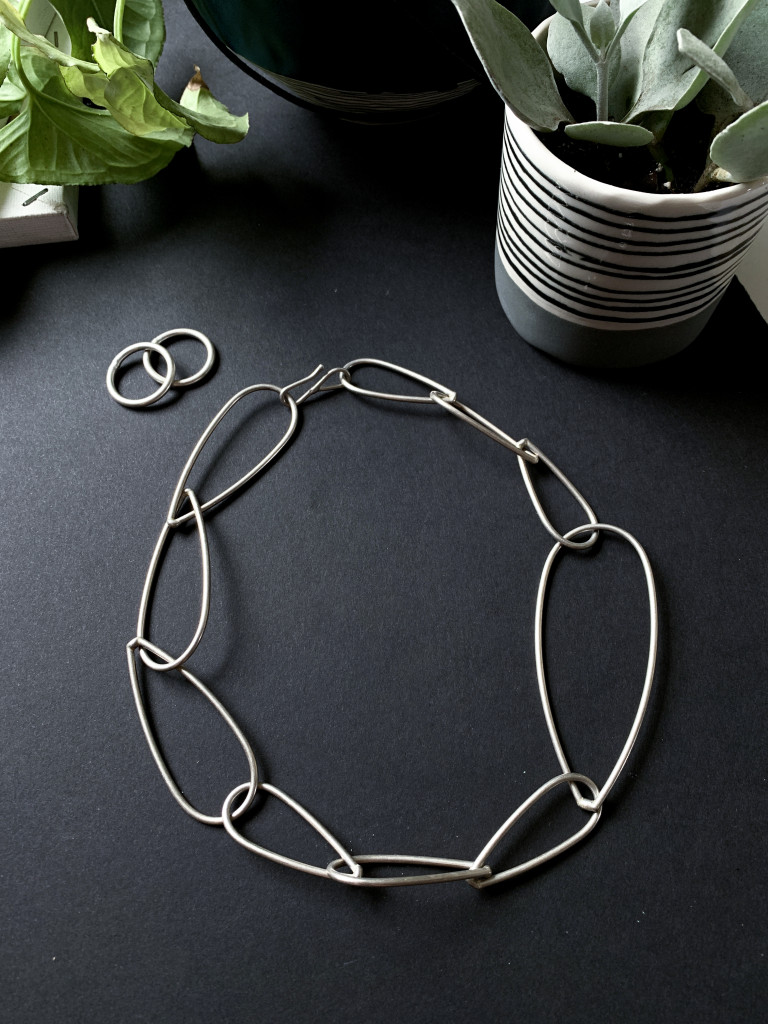 bold modern silver statement necklace and stacking rings