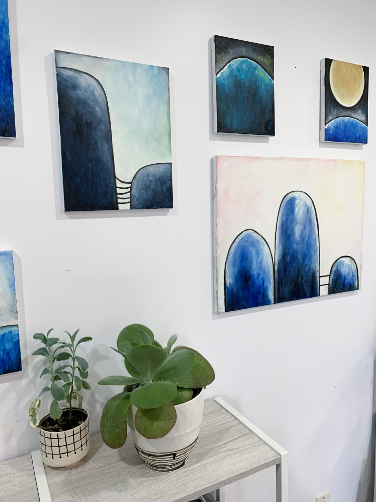new paintings (including one in progress) and plants in the studio of megan auman