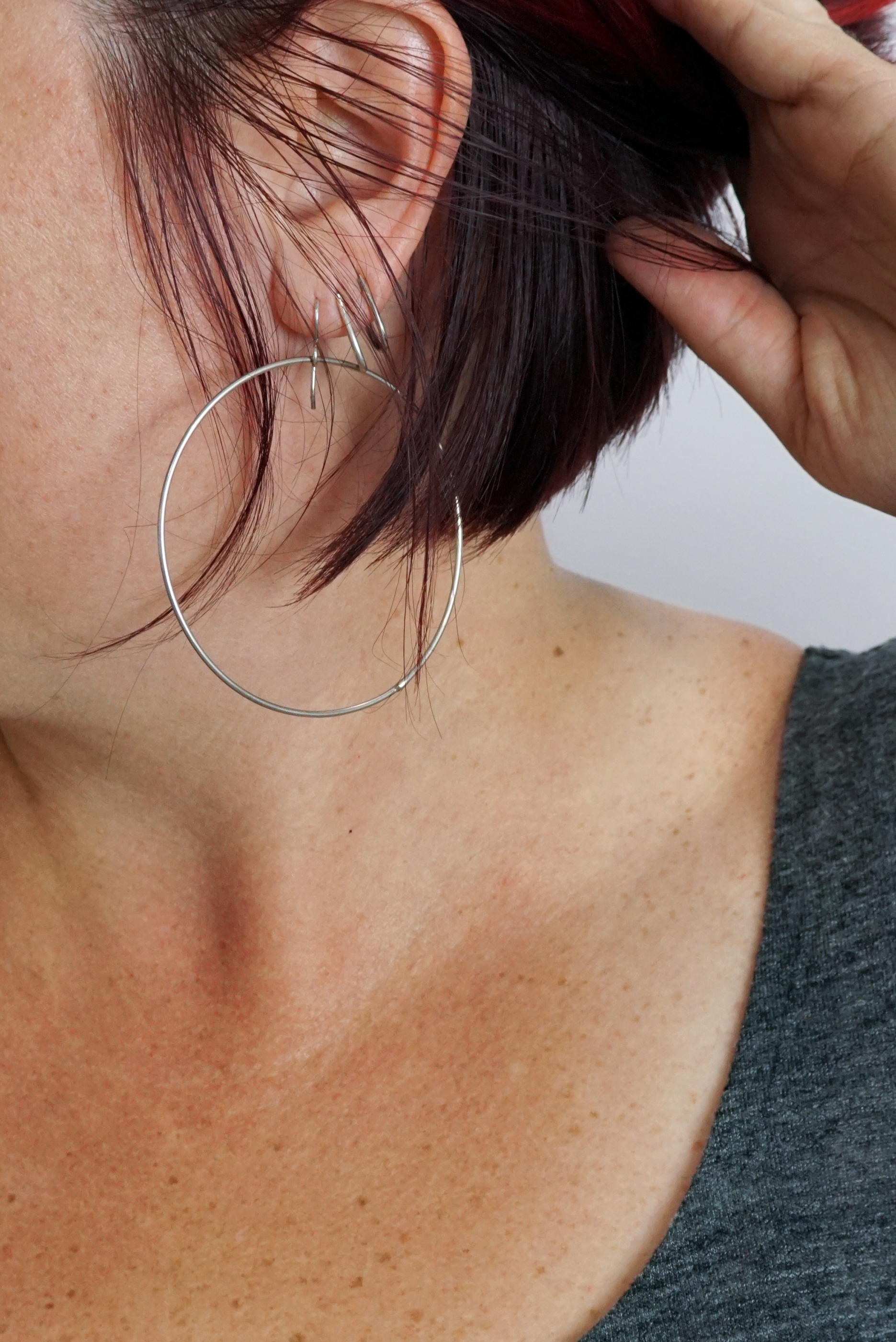 Profile Of A Beautiful Blackhaired Woman With Big Hoop Earrings Stock Photo  - Download Image Now - iStock