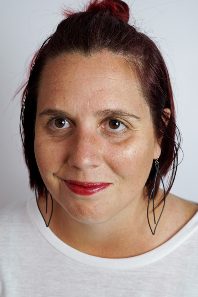 black statement earrings with white t-shirt and red lipstick