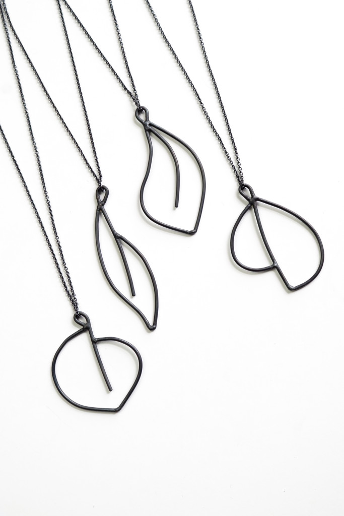 edgy and elegant black jewelry: necklaces inspired by minimal floral tattoos