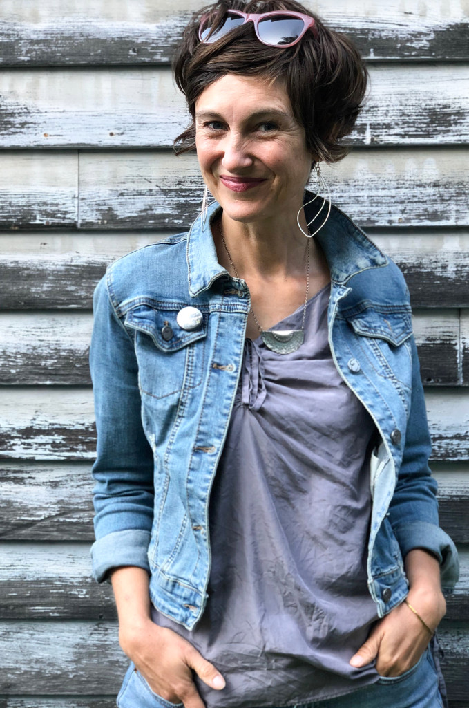 statement earrings and denim jacket