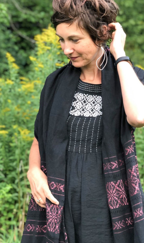 statement earrings with embroidered dress and scarf