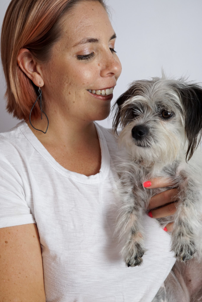 black statement earrings with white t-shirt and black and white dog