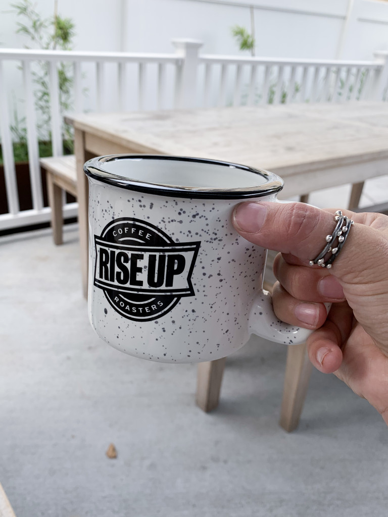 thumb rings and black and white coffee mug