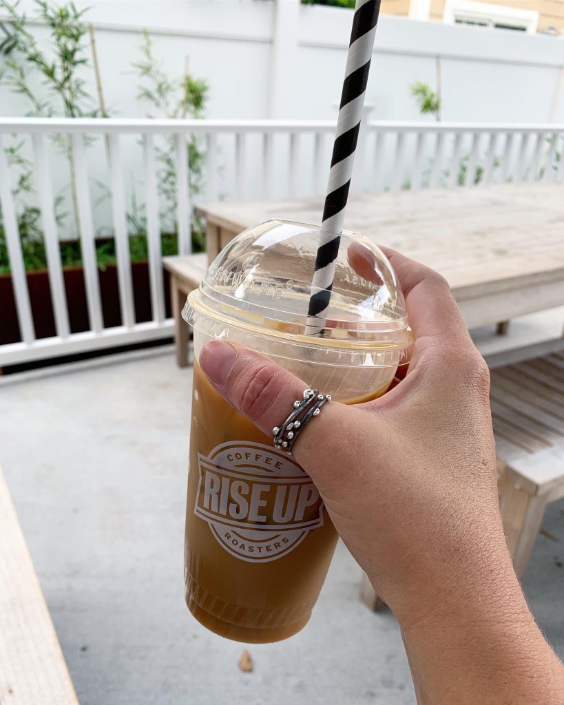 thumb rings, iced coffee, and paper straw