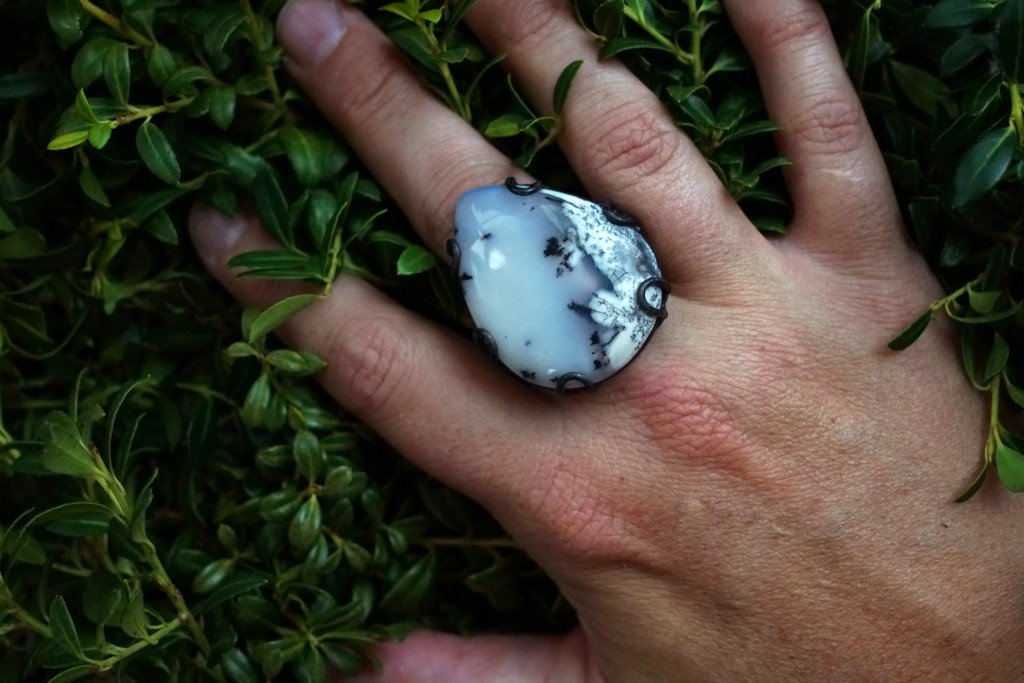 black and white statement ring with greenery