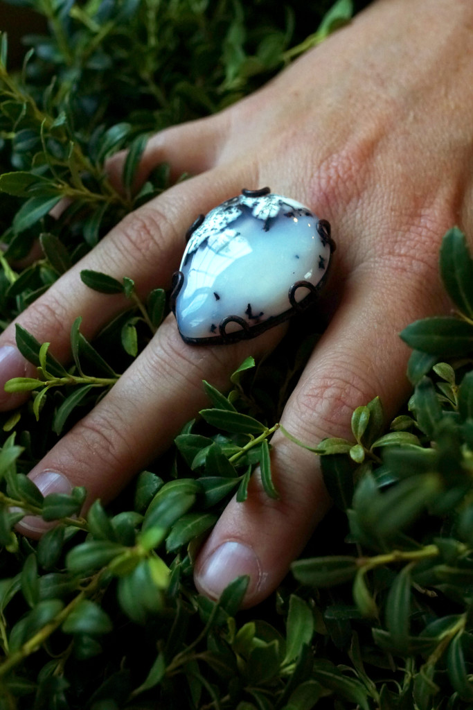 black and white statement ring with greenery