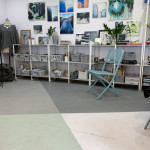 my studio gallery wall in detail (with painted plywood floor and plenty of plants!)