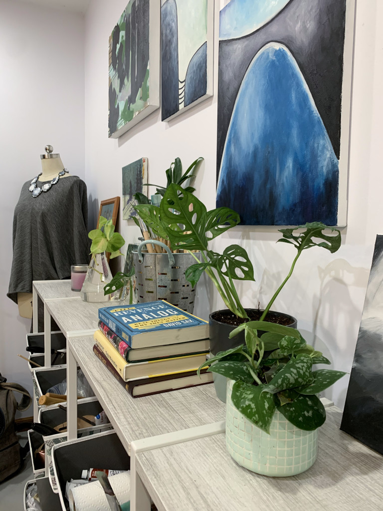 artist studio gallery wall detail with plants