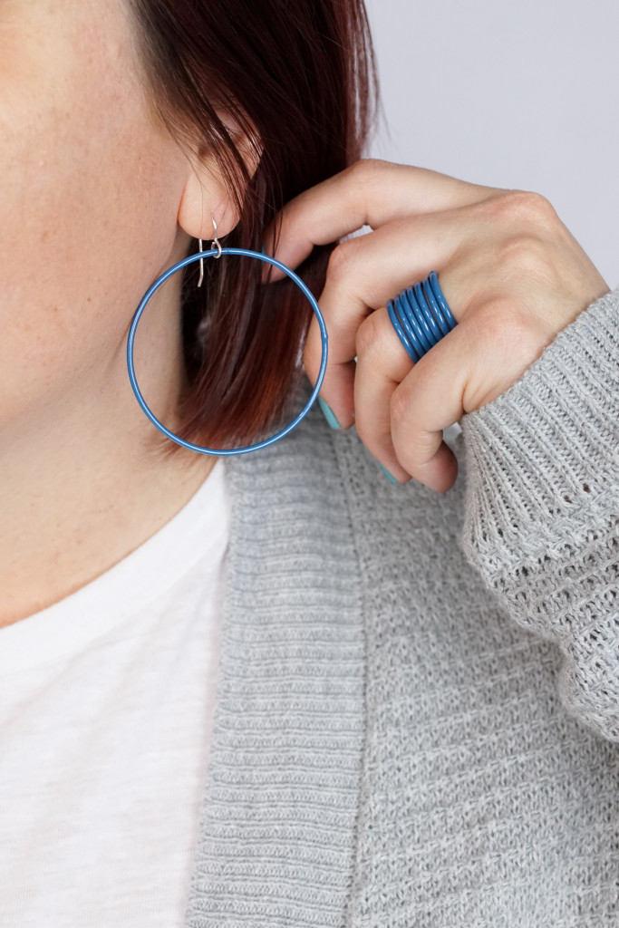 casual style: blue circle earrings and stacking rings with white t-shirt and grey cardigan