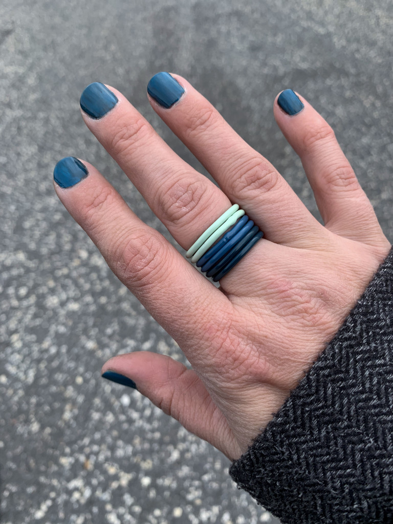 colorful jewelry: stacking rings in blue, teal, and mint green