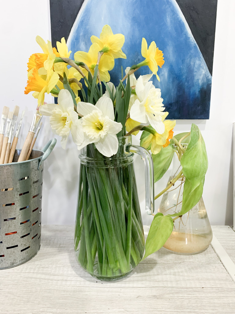 daffodils in art studio with painting