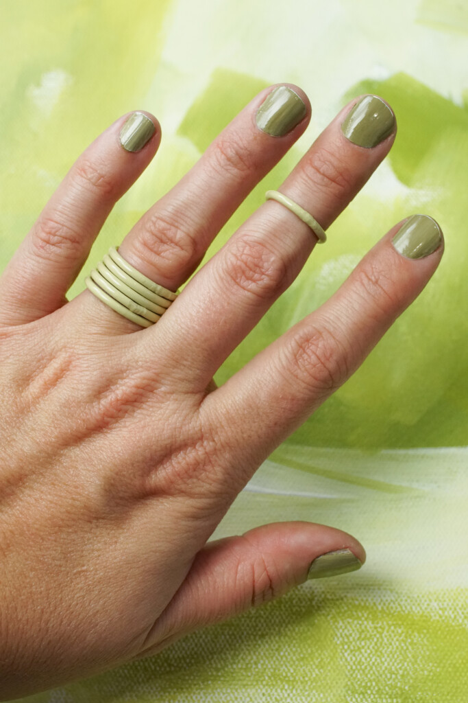yellow green stacking rings with matching nails and painting