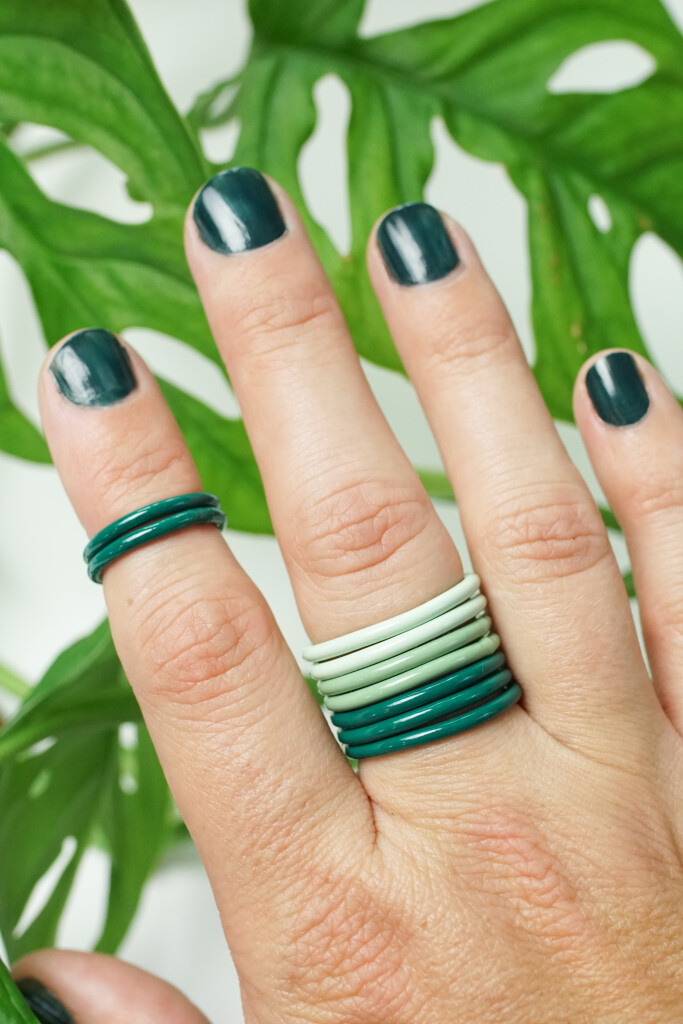 green stacking rings with monstera adansonii