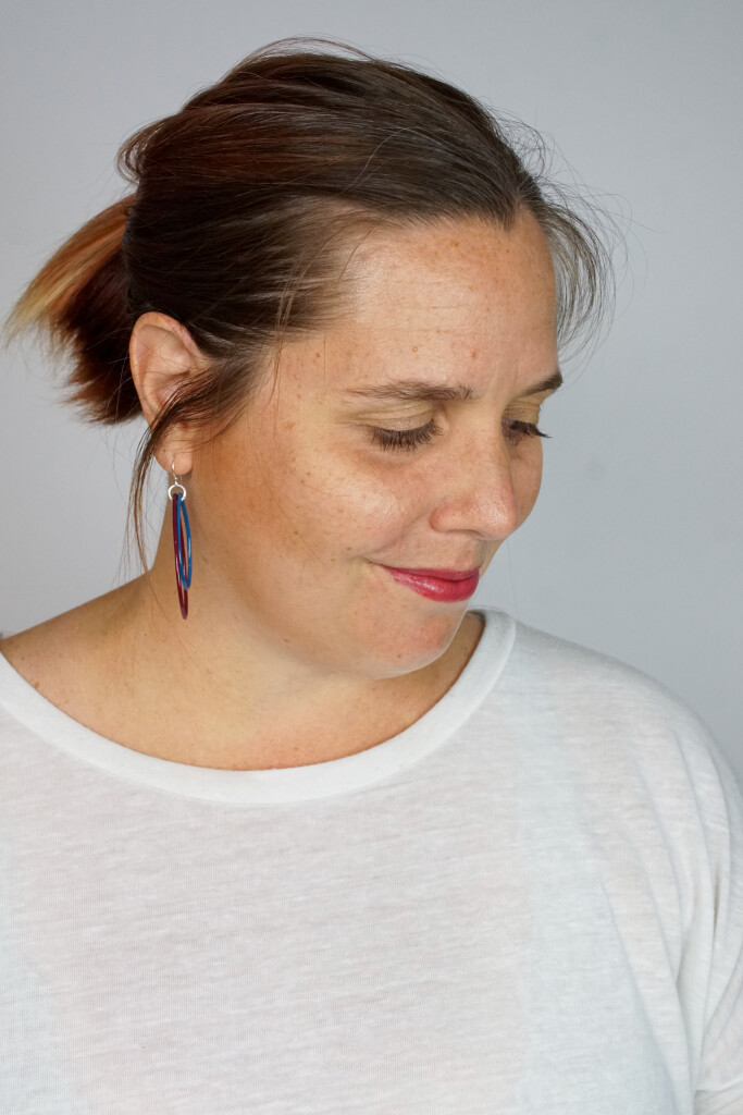 burgundy and blue handmade statement earrings with white t-shirt