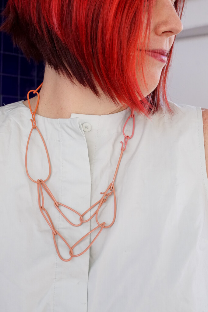 colorful statement necklace and blue tiled wall in Palm Springs