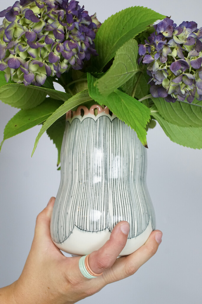 hydrangeas, a handmade vase, and stacking rings