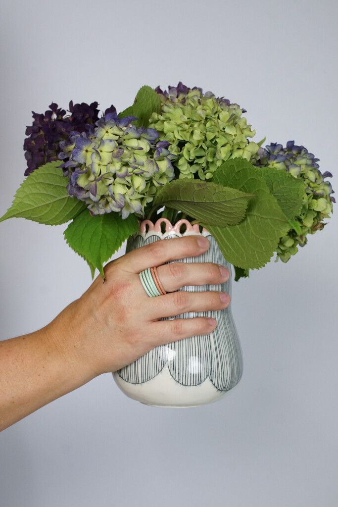 hydrangeas, a handmade vase, and stacking rings