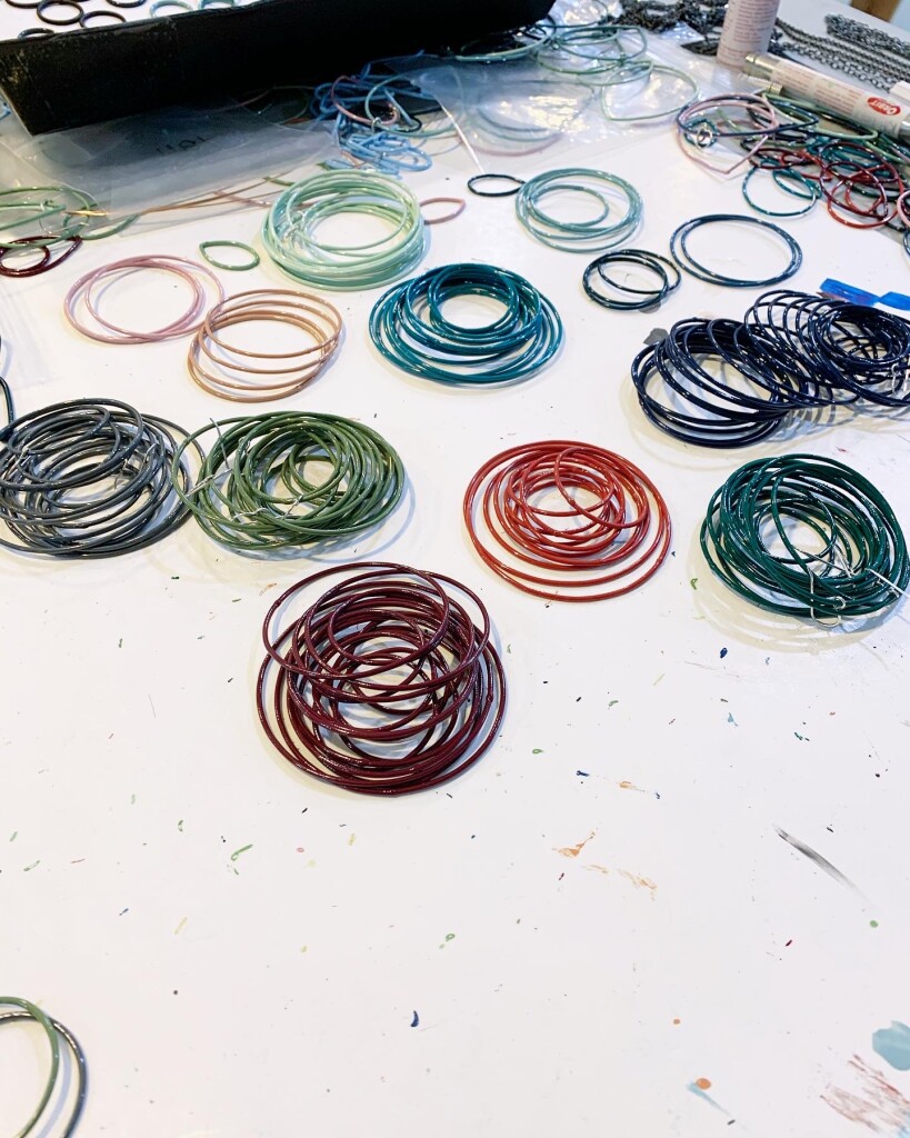 colorful earring components on the work table of metalsmith Megan Auman