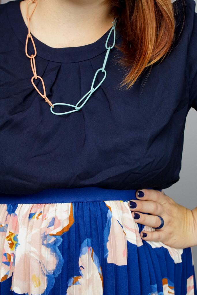 comfortable dressy outfit: floral skirt and colorful chain necklace