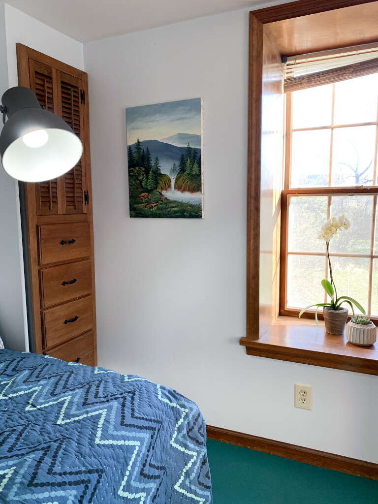 guest bedroom makeover with painted floor and art