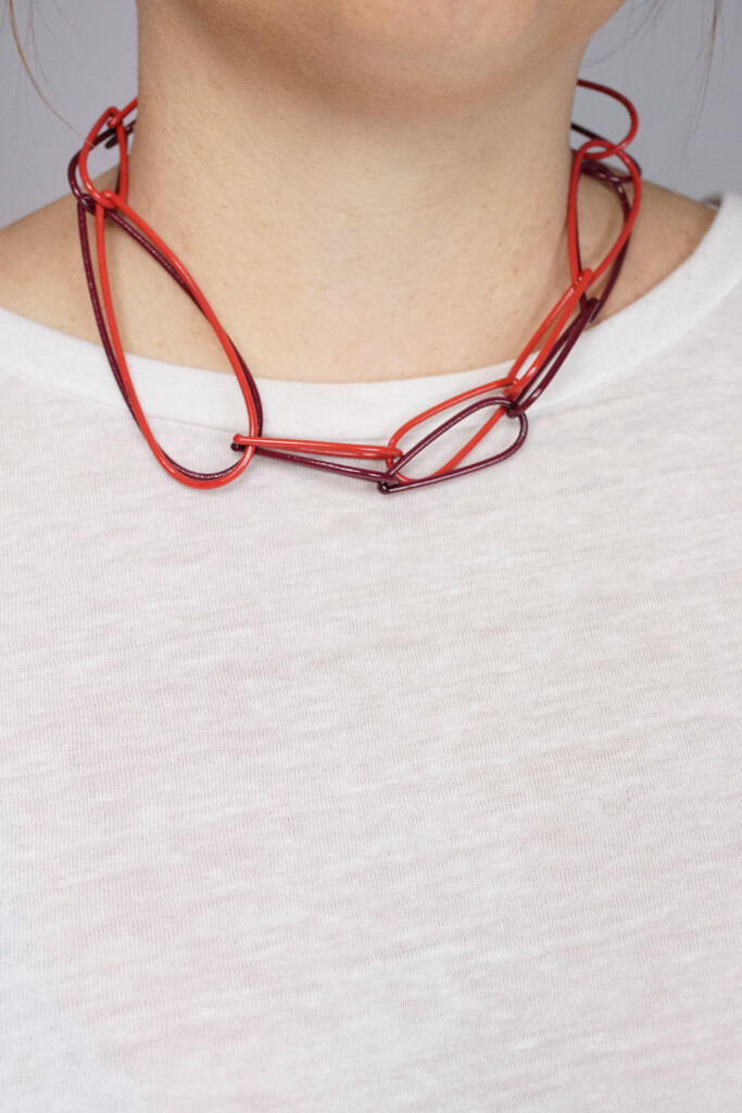 layered red and burgundy chunky chain necklaces by designer and metalsmith Megan Auman