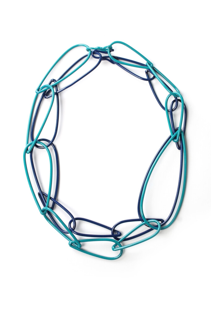 layered teal and dark blue chunky chain necklaces by designer and metalsmith Megan Auman
