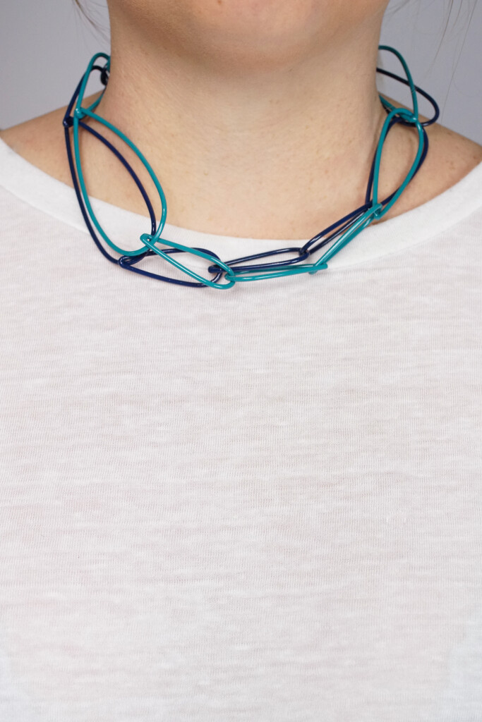 layered teal and dark blue chunky chain necklaces by designer and metalsmith Megan Auman