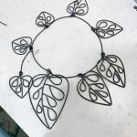 a new necklace/wall hanging in progress (inspired by Calder and one of my favorite plants, monstera adansonii)