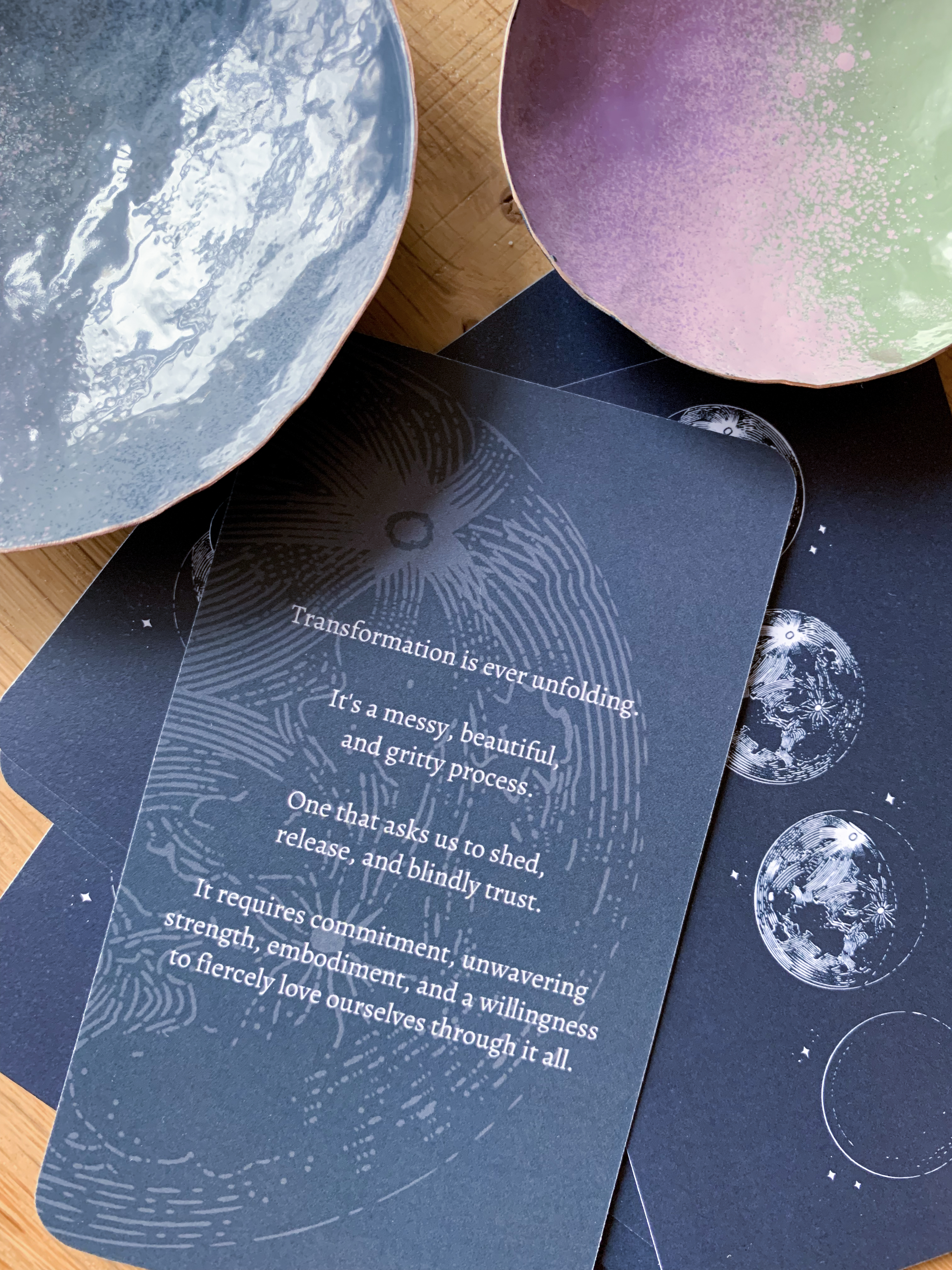 moon mantra oracle deck and colorful copper dishes