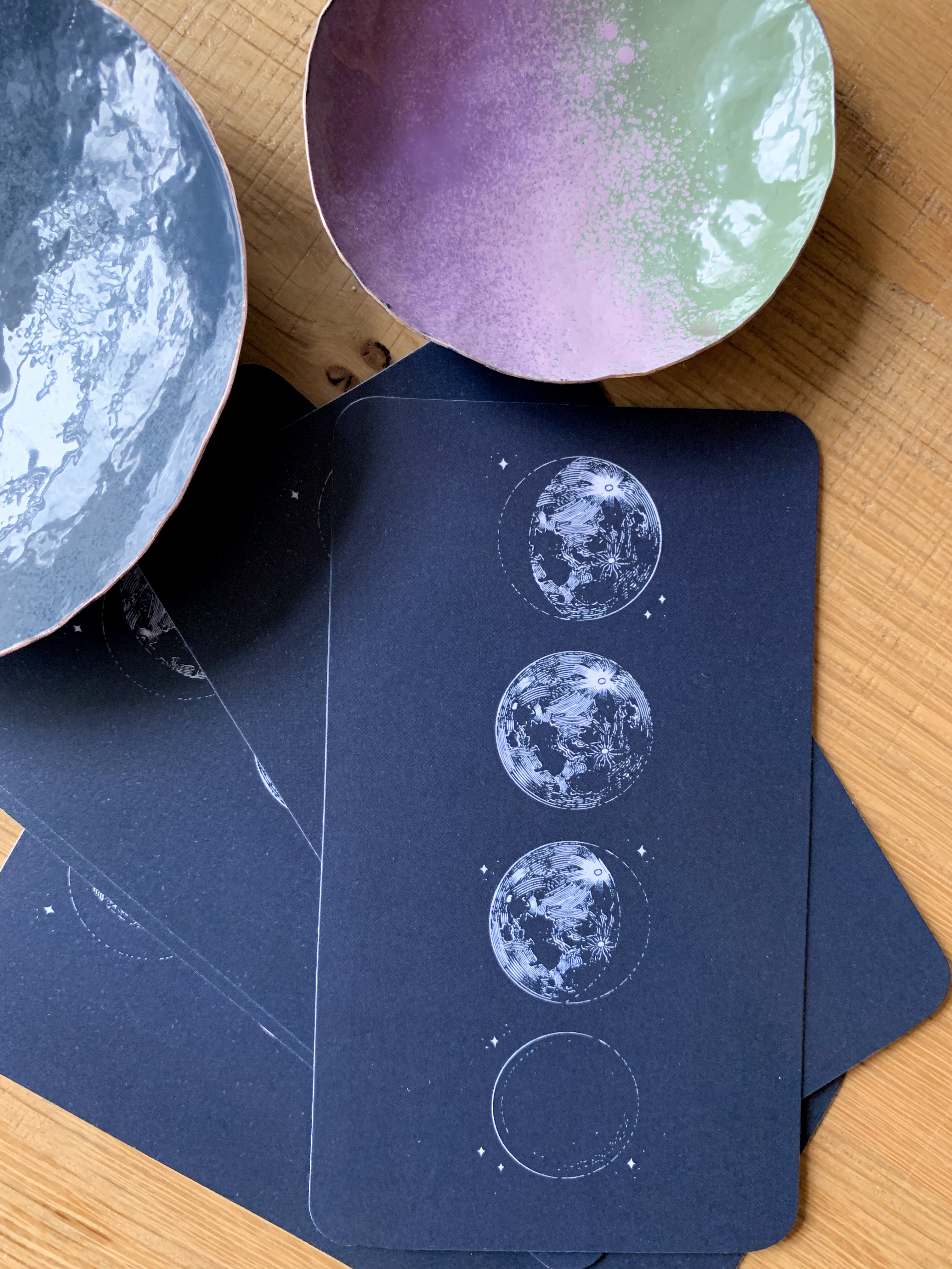 moon mantra deck and colorful copper dishes