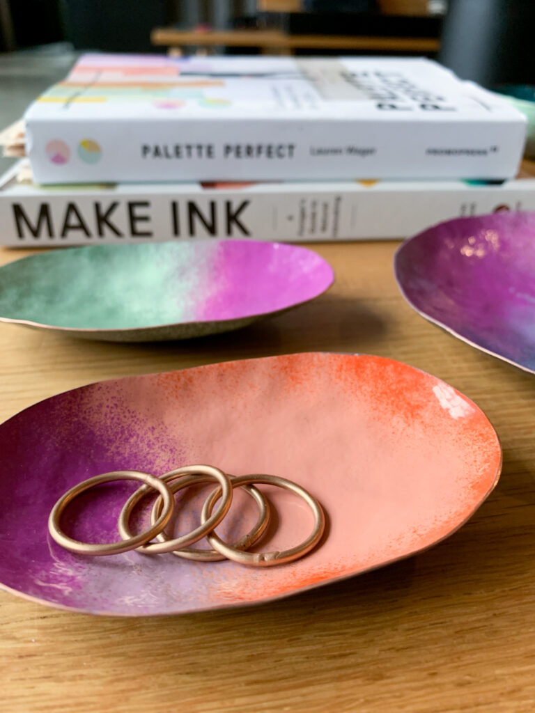 colorful metal ring dishes and books