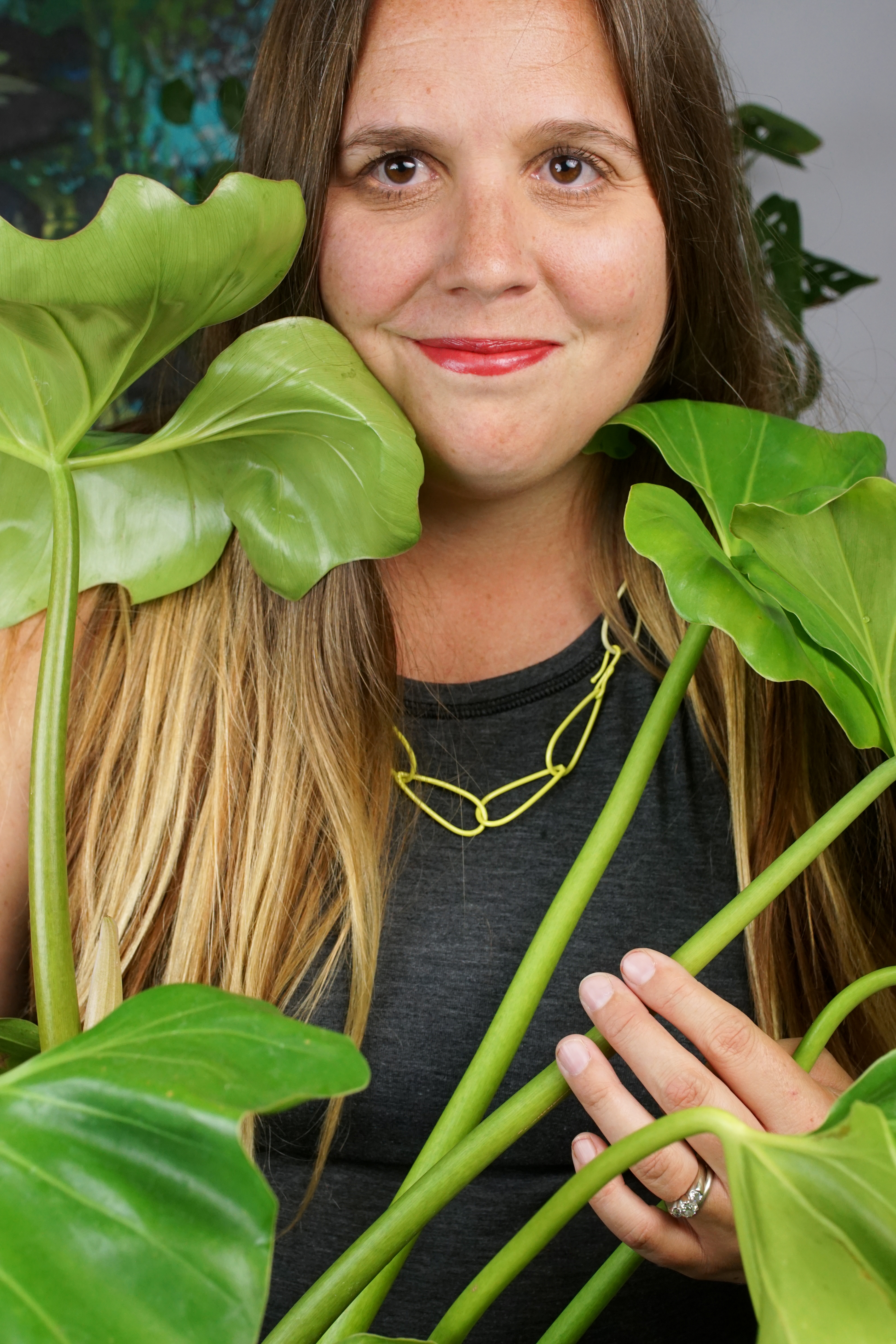 self-portait with large philodendron