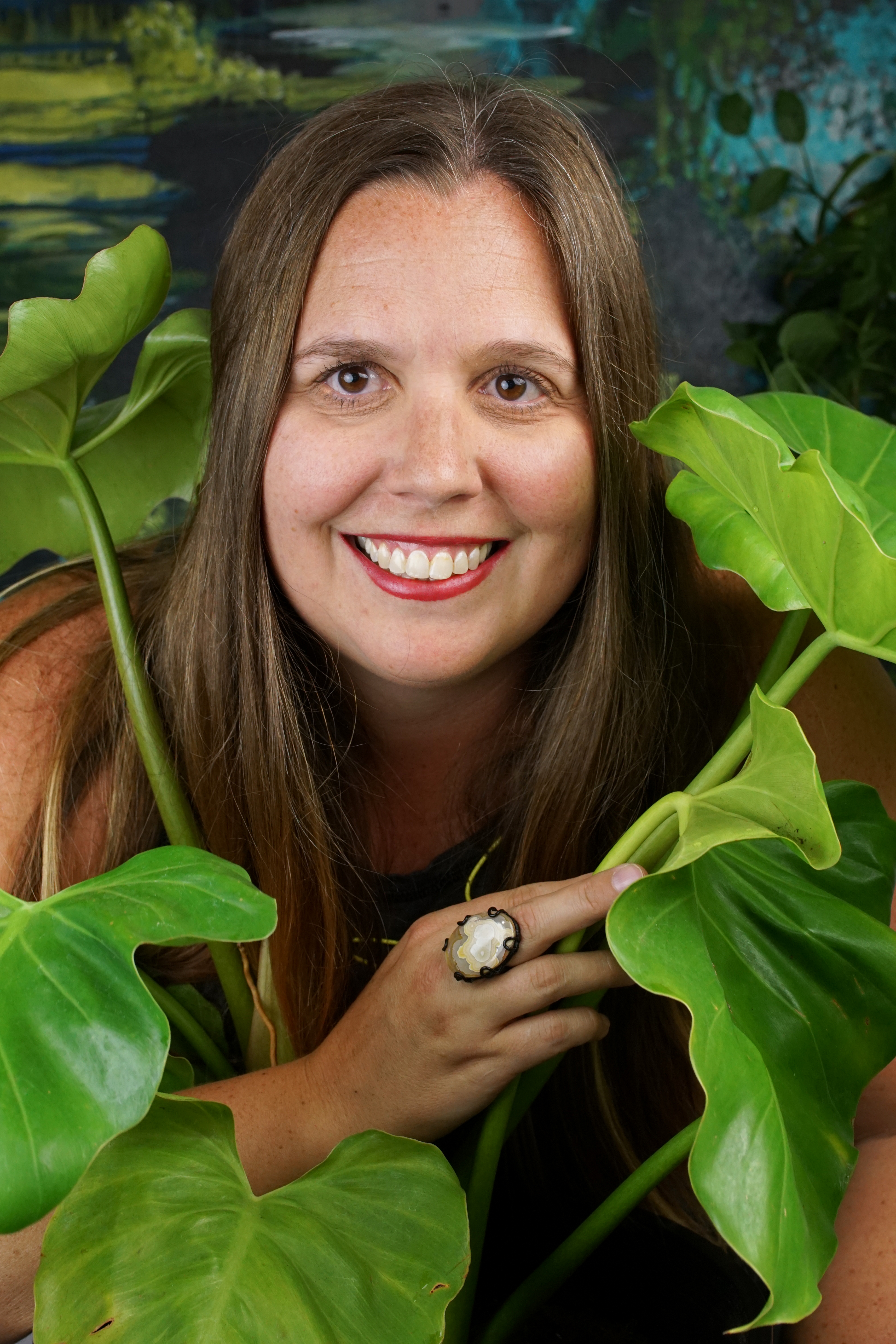 self-portait with large philodendron