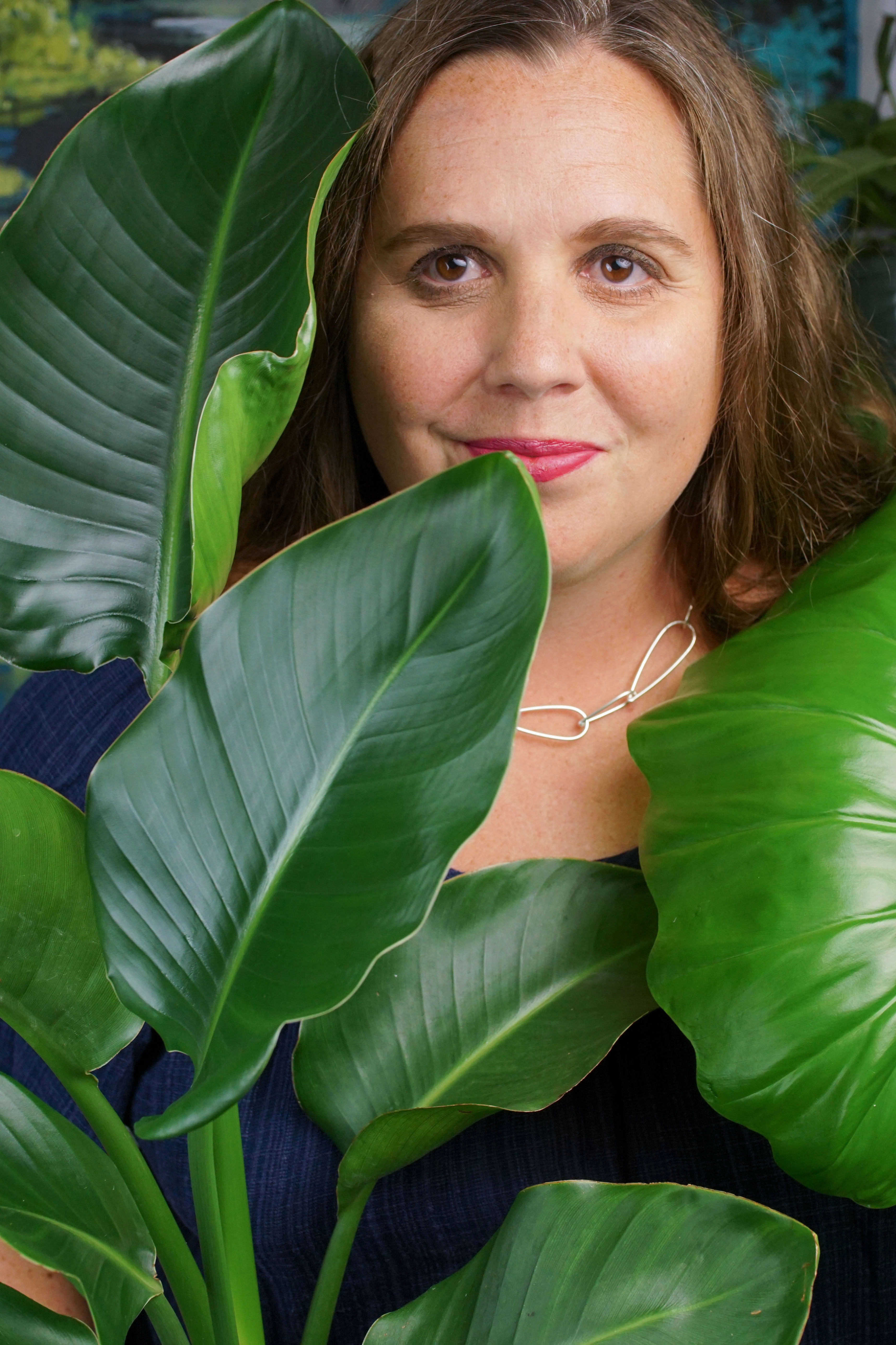 tropical resort jungle vibes: self portrait with plants and chunky silver chain necklace